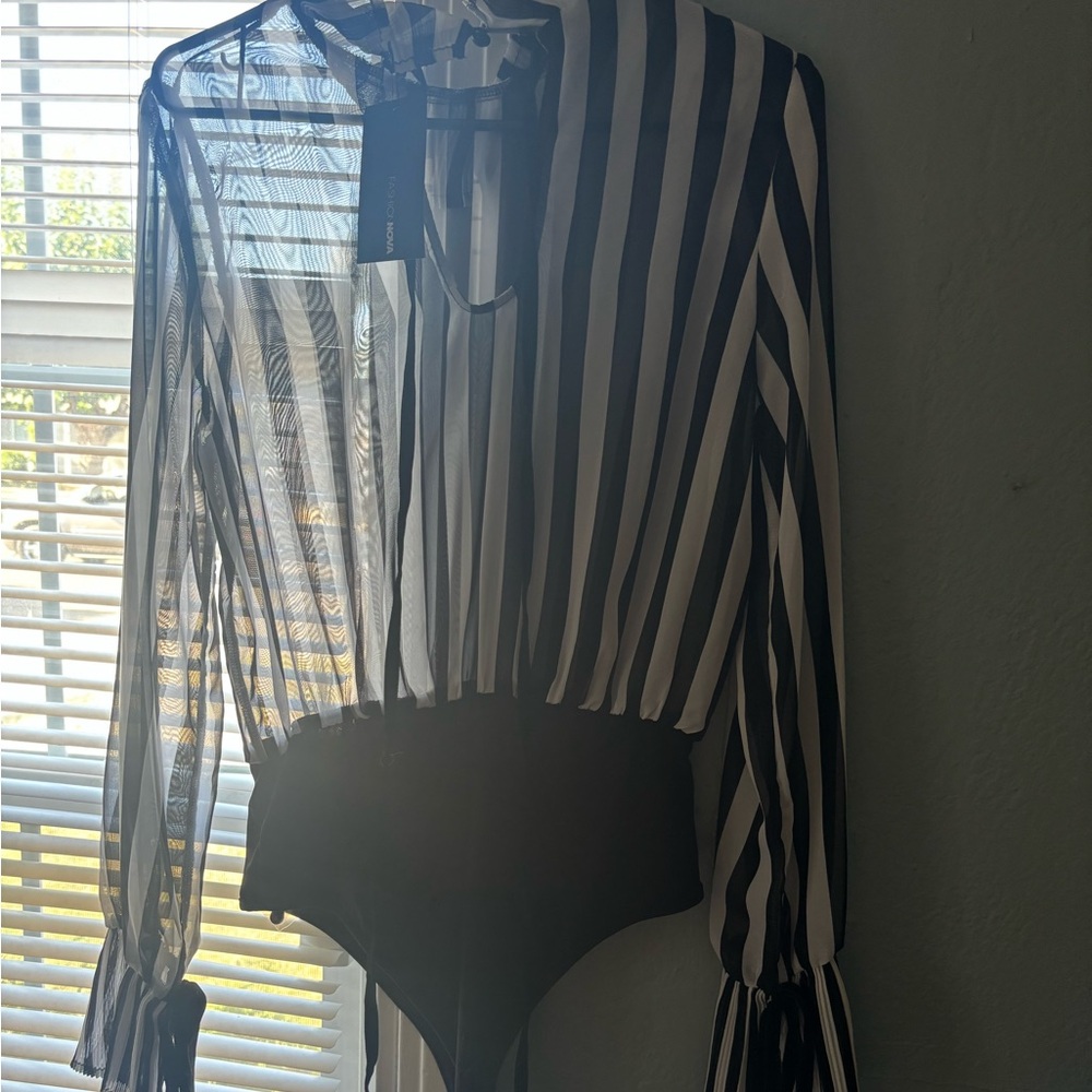 Hey lady’s I have brand new fashion nova all over me bodysuit